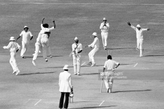 Sarfraz Nawaz of Pakistan (4th left) is congratulated by teammate Javed Miandad after bowling Bishan Bedi of India for 1 run during the 2nd Test match between Pakistan and India at Gaddafi Stadium, Lahore, Pakistan, 1st November 1978. The other fielders for Pakistan are (from far left) Mudassar Nazar, Mushtaq Mohammad, Asif Iqbal, Majid Khan and wicketkeeper Wasim Bari; the non-striking batsman for India is Syed Kirmani. Pakistan won the match by 8 wickets. (Photo by Patrick Eagar/Popperfoto via Getty Images)