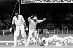 Dilip Vengsarkar of India is caught for 17 runs by Pakistan wicketkeeper Wasim Bari off the bowling of Mudassar Nazar (not in picture) during the 2nd Test match between Pakistan and India at Gaddafi Stadium, Lahore, Pakistan, 1st November 1978. The other fielder for Pakistan is Majid Khan. Pakistan won the match by 8 wickets. (Photo by Patrick Eagar/Popperfoto via Getty Images)