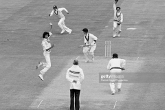 Kim Hughes of Australia is out LBW for 15 runs to Sikander Bakht of Pakistan during the Prudential World Cup group match between Australia and Pakistan at Trent Bridge, Nottingham, 14th June 1979. The fielders for Pakistan are Majid Khan and wicketkeeper Wasim Bari; the non-striking batsman for Australia is Andrew Hilditch and the umpire is Ken Palmer. The match was completed on the reserve day, as Pakistan won by 89 runs. (Photo by Patrick Eagar/Popperfoto via Getty Images)
